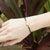 สร้อยข้อมือหนังถัก ตัวล็อครูปหัวใจ สแตนเลส สตีล รุ่น MNC-BR600 - สร้อยข้อมือแฟชั่น สร้อยข้อมือผู้หญิง