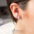 ต่างหูสตั๊ดสแตนเลส ลาย Fleur-de-lis ดีไซน์ Unisex รุ่น MNC-ER749 - ต่างหูผู้หญิง ต่างหูผู้ชาย